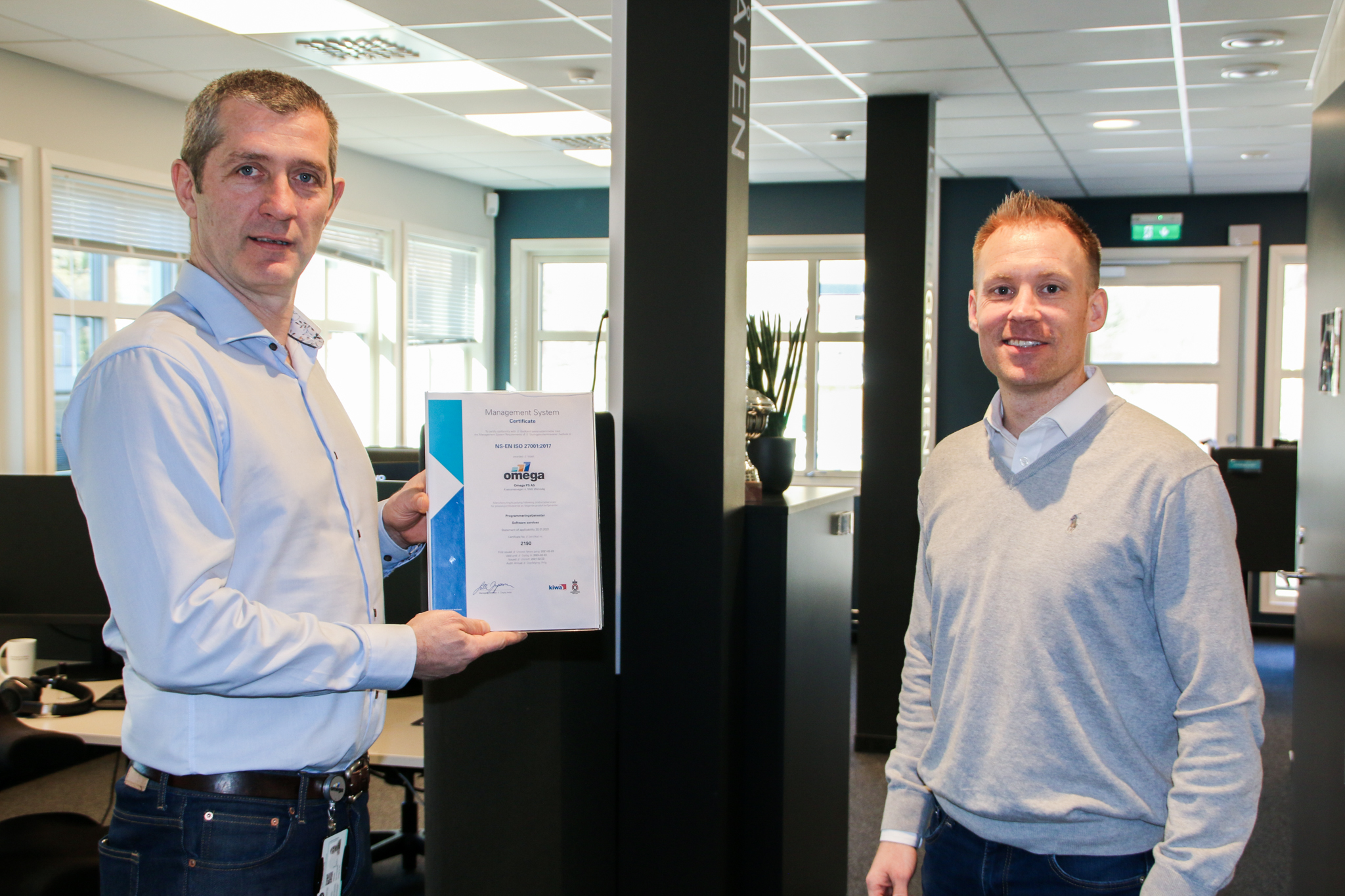 General manager in Omega PS, Svein Tore Haraldseid and Chief Technology Officer, Jan Christian Brataas, proudly show us the ISO certificate.